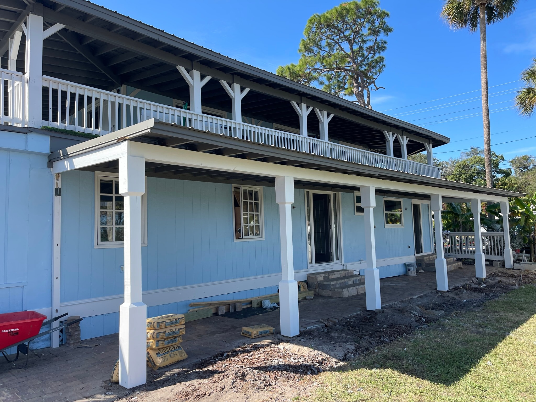 McCoy House renovation in progress — pressure washing patio pavers