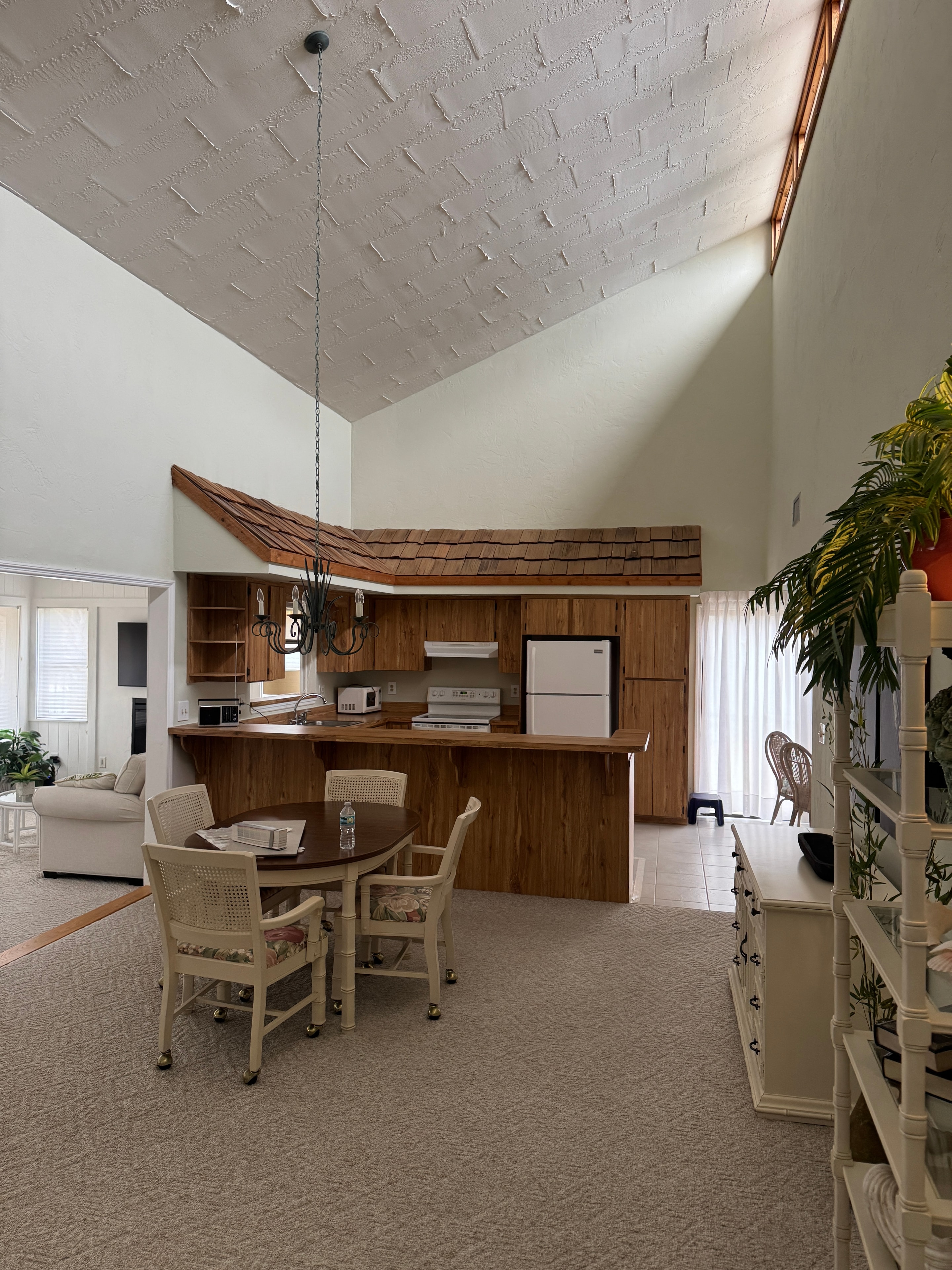 Pelican Bay Condo before renovation — open living space original finishes